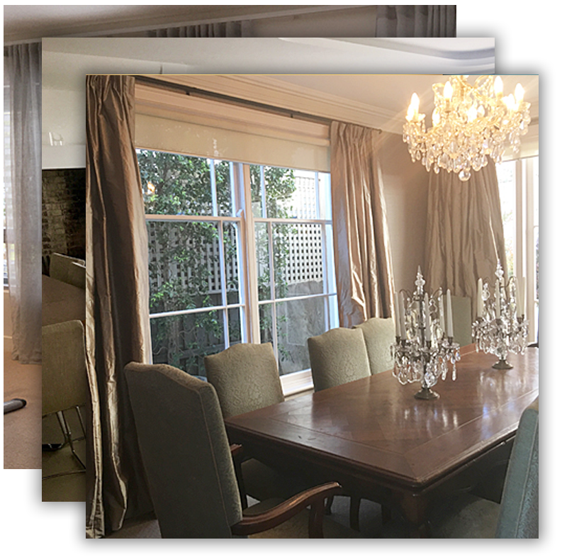 Elegant dining room with a crystal chandelier over a wooden table and green chairs, near window with curtains.