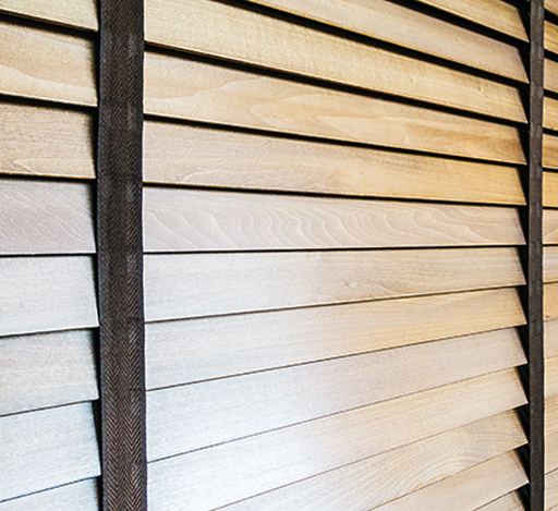 Wooden slats wall texture with horizontal lines and a vertical black strap.